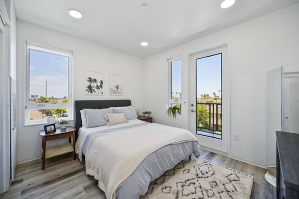 Bedroom featuring cozy decor and plush bedding in 2911 Adams Apartments, Greystar luxury apartments in a serene neighborhood