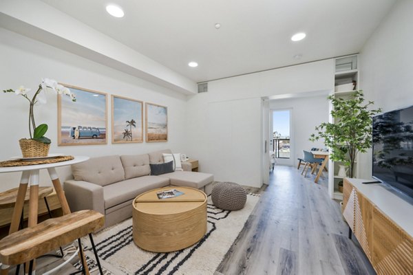 Spacious living room with modern furnishings at 2911 Adams Apartments, luxury Greystar property