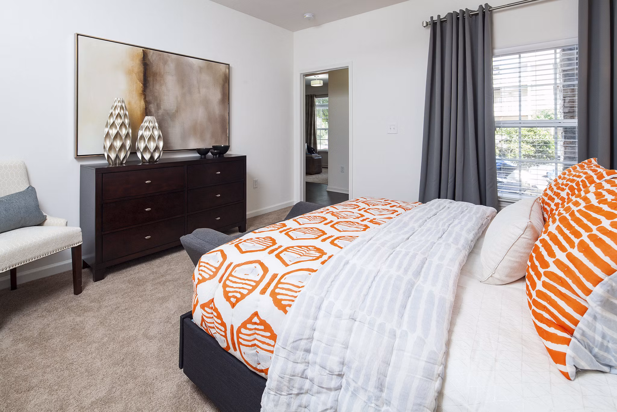 Bedroom showcasing modern decor and natural light at Avana Portico Apartments, a Greystar luxury community