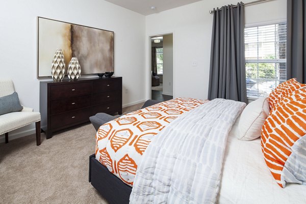 Bedroom showcasing modern decor and natural light at Avana Portico Apartments, a Greystar luxury community