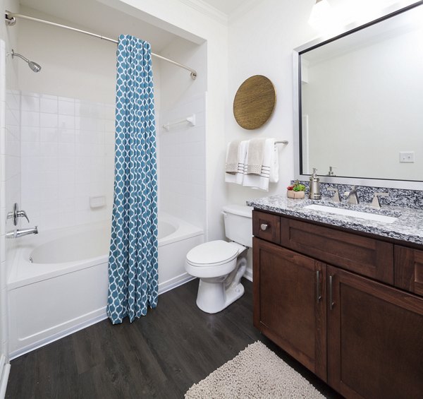 Spa-inspired bathroom featuring a sleek vanity and rainfall shower in Avana Portico Apartments Ideal for modern luxury living