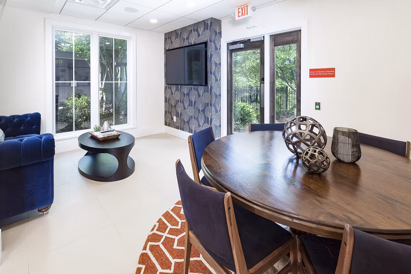 Dining area with modern furnishings at Avana Portico Apartments, featuring a stylish ambiance perfect for entertaining guests and relaxed dining