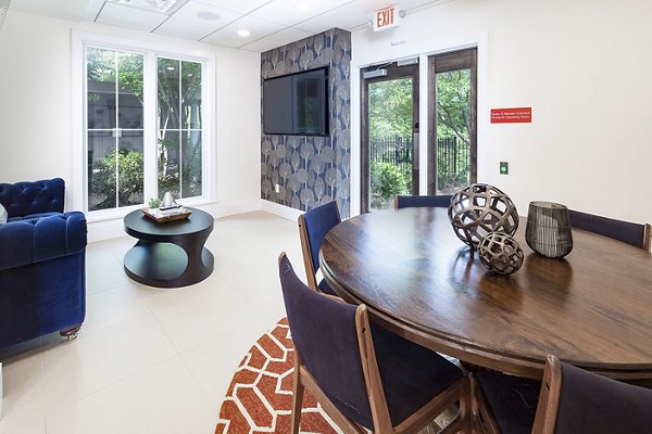 Dining area with modern furnishings at Avana Portico Apartments, featuring a stylish ambiance perfect for entertaining guests and relaxed dining