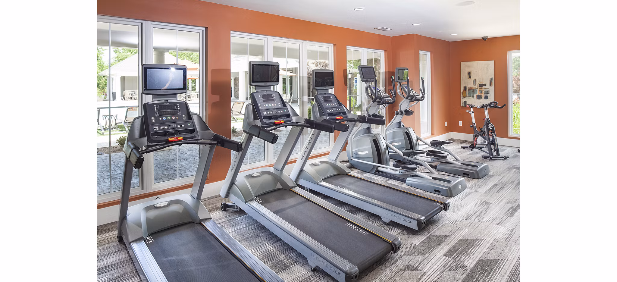 Modern fitness center with state-of-the-art equipment at Avana Portico Apartments