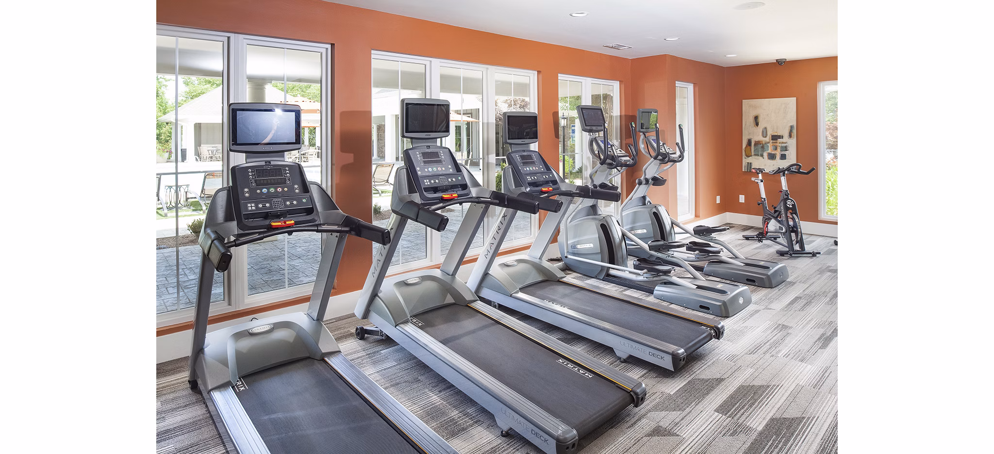 Modern fitness center with state-of-the-art equipment at Avana Portico Apartments