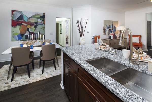 Modern kitchen with stainless steel appliances at Avana Portico Apartments