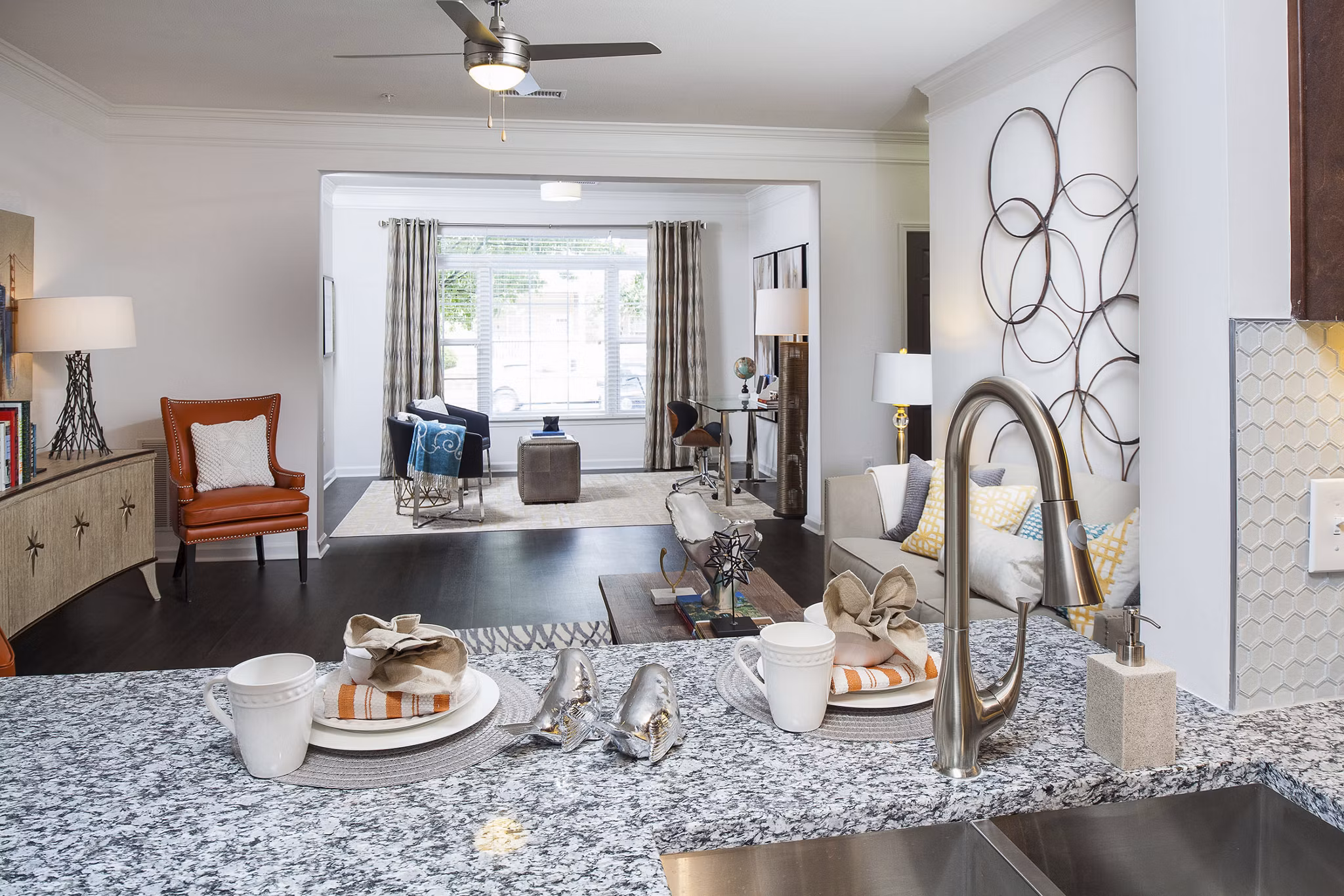 Modern kitchen with granite countertops and stainless steel appliances at Avana Portico Apartments