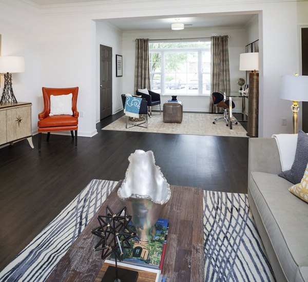Elegant living room with modern furnishings and natural light in Avana Portico Apartments
