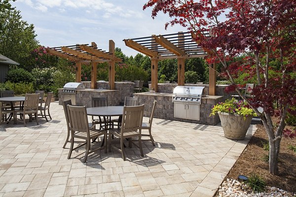 Outdoor barbecue grills in the modern entertainment area at Avana Portico Apartments, perfect for hosting gatherings and enjoying luxury amenities