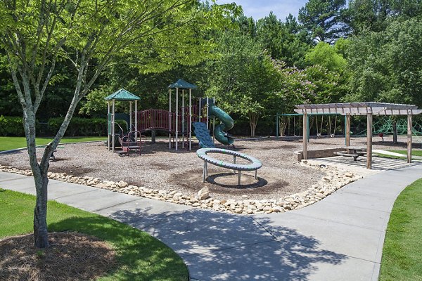 Modern playground with vibrant equipment at Avana Portico Apartments, offering luxury family-friendly amenities