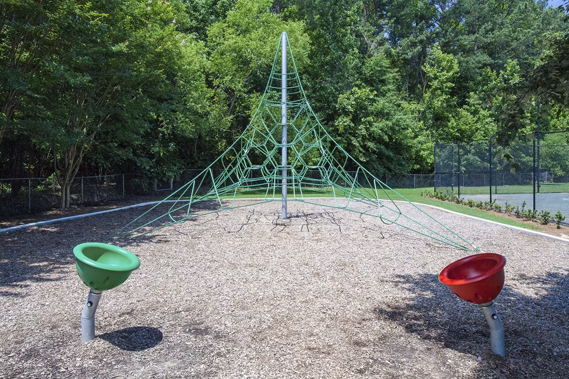 Playground at Avana Portico Apartments featuring modern equipment and safe play areas for children