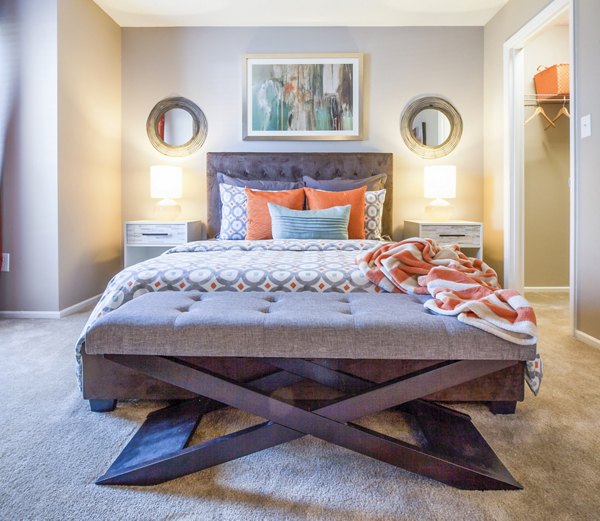 Bedroom with modern furnishings and natural light at Avana Matthews Apartments