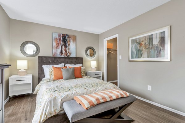 Cozy bedroom featuring modern furniture and natural lighting at Avana Matthews Apartments