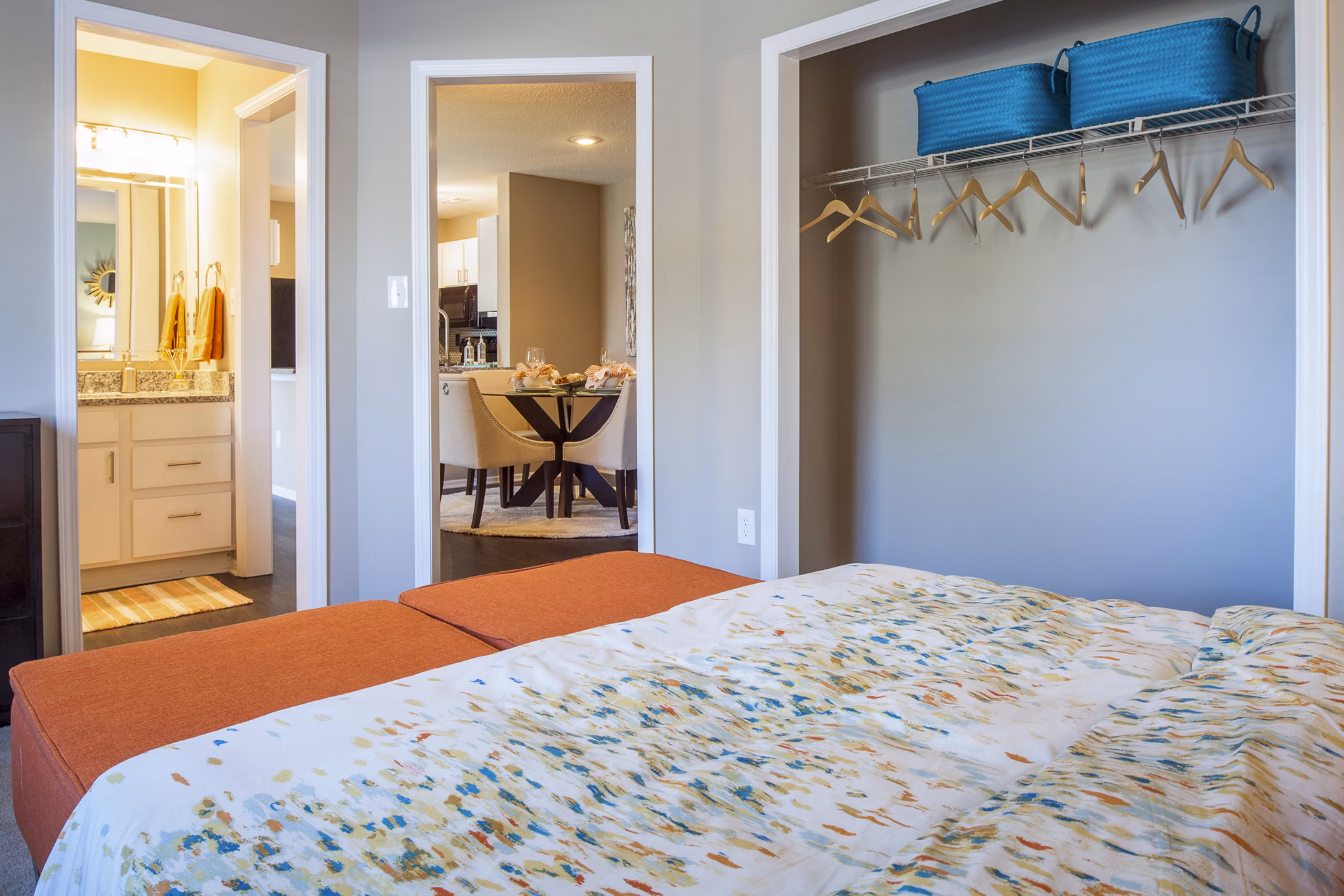 Cozy bedroom with modern decor at Avana Matthews Apartments, featuring plush bedding and ample natural light