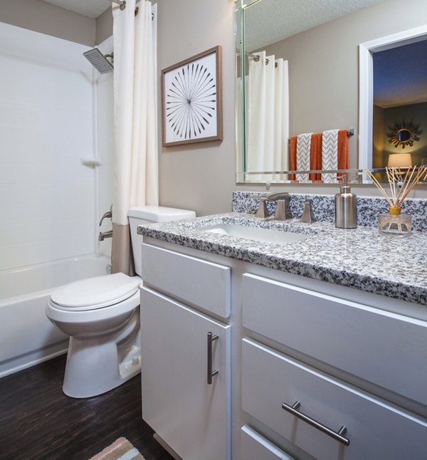 Bathroom with modern fixtures and marble countertops at Avana Matthews Apartments