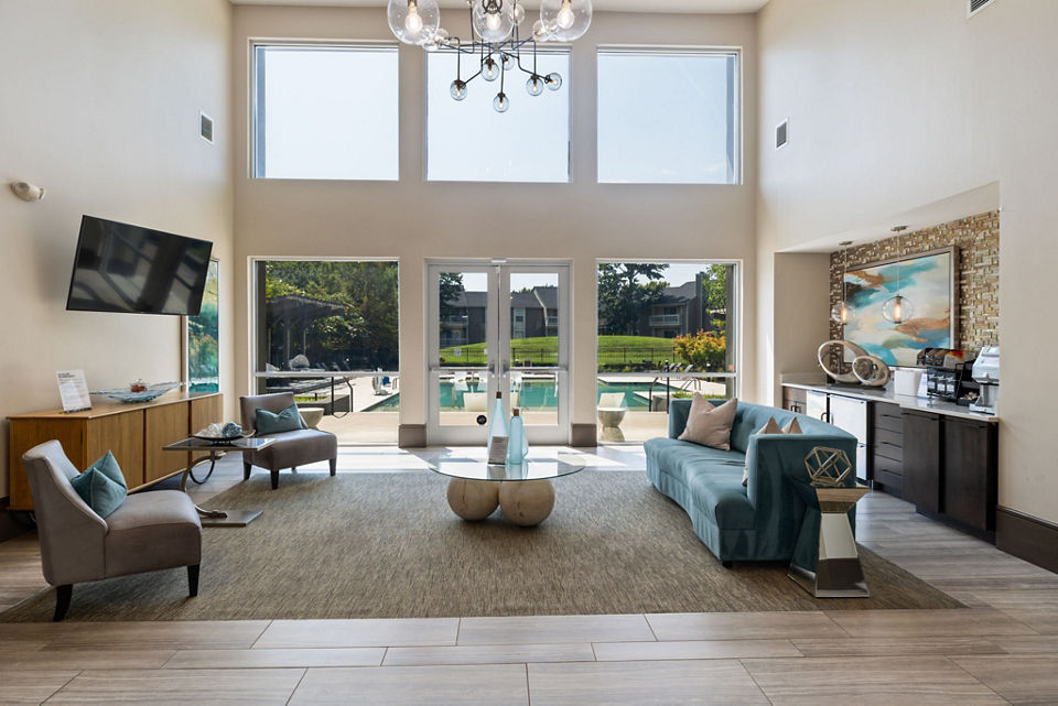 Clubhouse at Avana Matthews Apartments: Modern recreation area with pool tables and seating in Charlotte luxury apartments