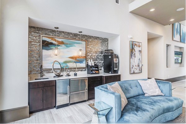 Modern clubhouse with cozy seating and game area at Avana Matthews Apartments