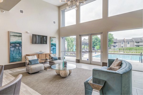 Modern clubhouse with gathering spaces at Avana Matthews Apartments featuring luxury amenities for residents