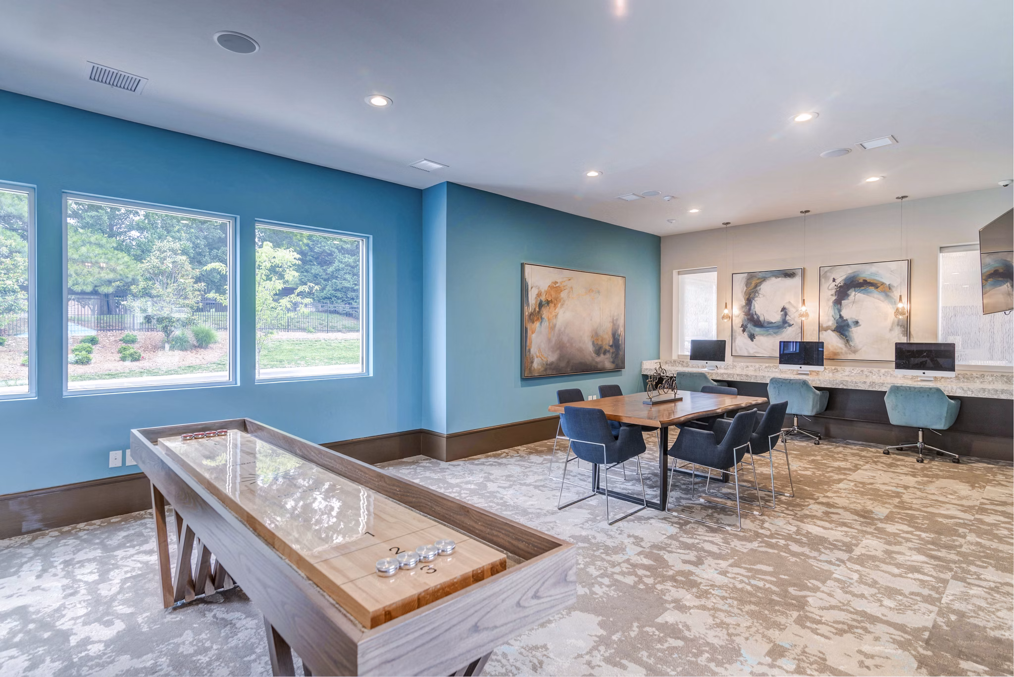 Game room with pool table and cozy seating at Avana Matthews Apartments Perfect for socializing and entertainment in a luxury setting