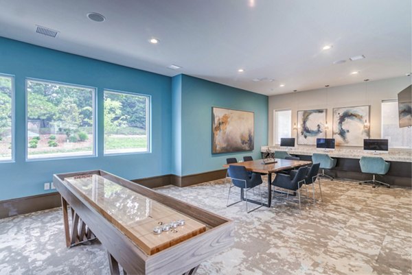 Game room with pool table and cozy seating at Avana Matthews Apartments Perfect for socializing and entertainment in a luxury setting
