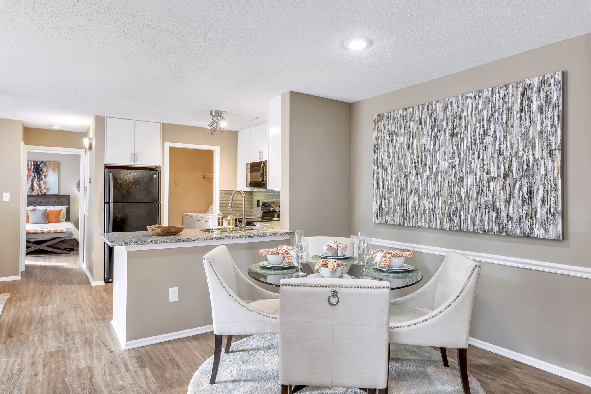 Dining room with modern decor and elegant lighting at Avana Matthews Apartments