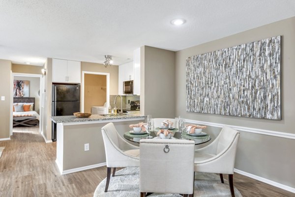 Dining room with modern decor and elegant lighting at Avana Matthews Apartments