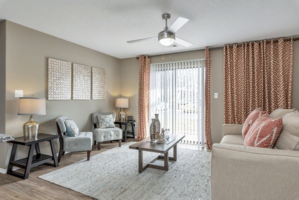 Spacious living room with modern decor and hardwood floors at Avana Matthews Apartments Perfect for hosting or relaxing in luxury