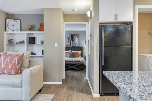 Cozy living room with modern decor and natural light in Avana Matthews Apartments, perfect for relaxing and entertaining