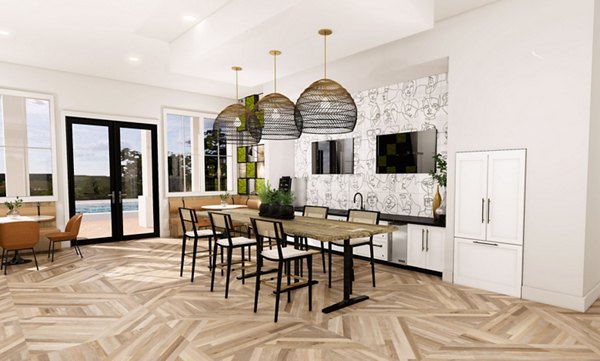 Clubhouse featuring modern decor and a spacious lounge area at Alta Harris Farms Apartments