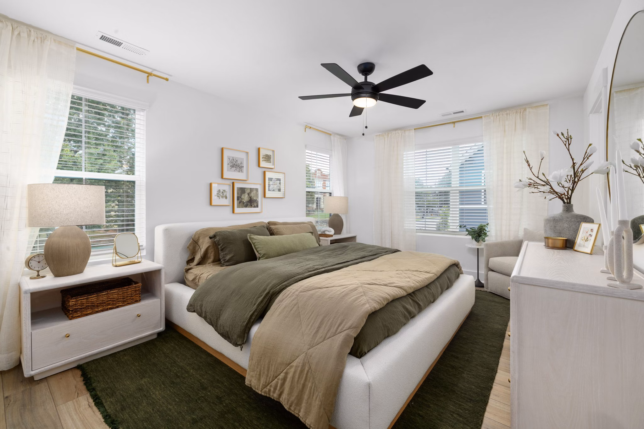 Stylish bedroom with modern decor at ABODE at Hargett Apartments, offering luxury living in the heart of the city