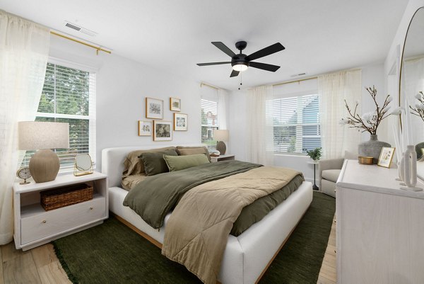 Stylish bedroom with modern decor at ABODE at Hargett Apartments, offering luxury living in the heart of the city