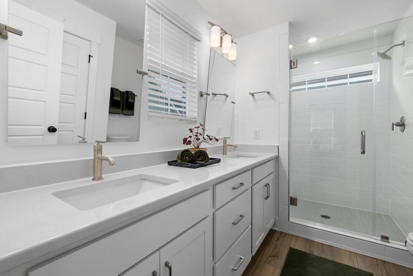 Elegant bathroom with modern fixtures at ABODE at Hargett Apartments