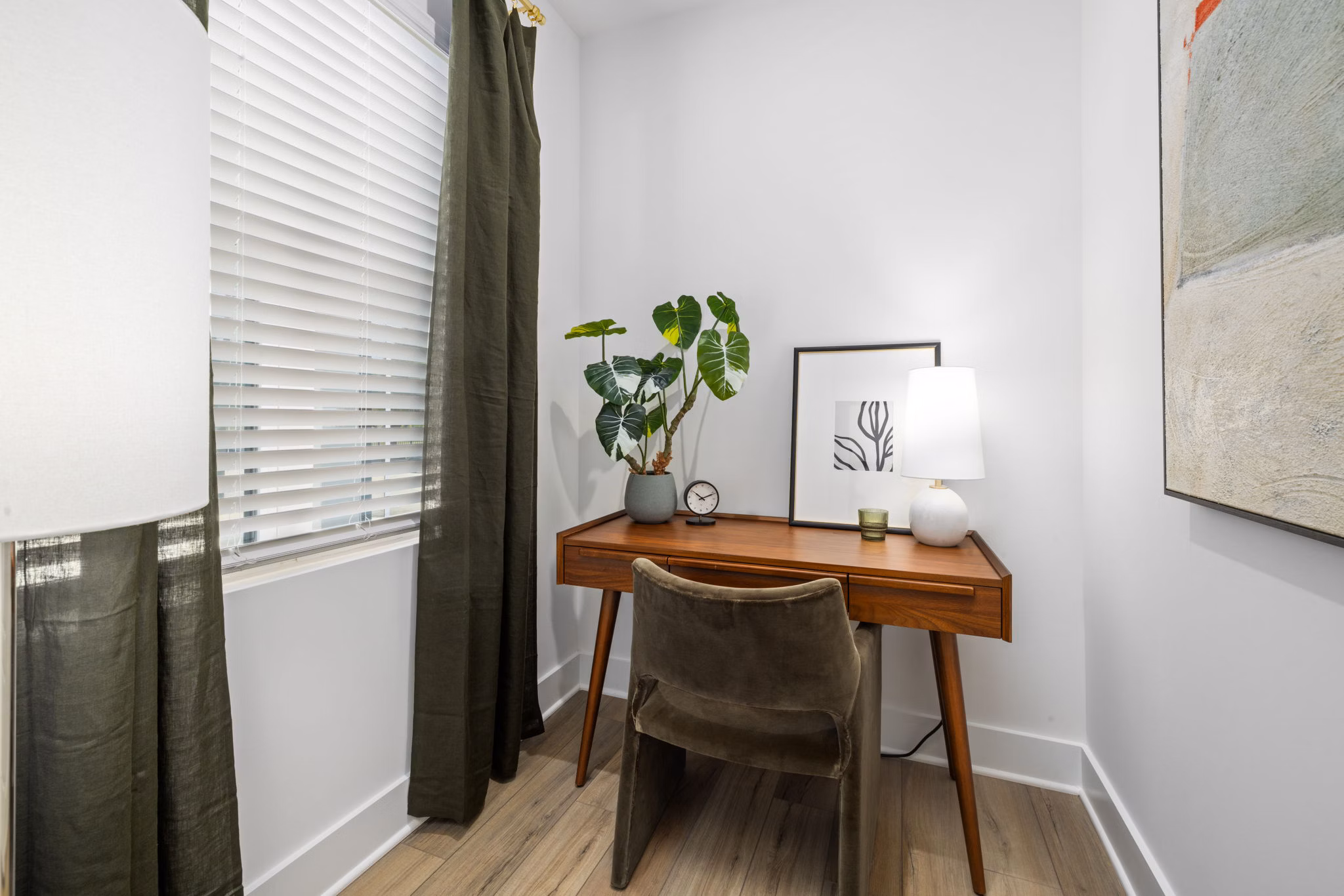 Home office with modern desk and ergonomic chair at ABODE at Hargett Apartments