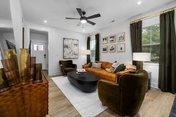 Comfortable living room with modern decor at ABODE at Hargett Apartments