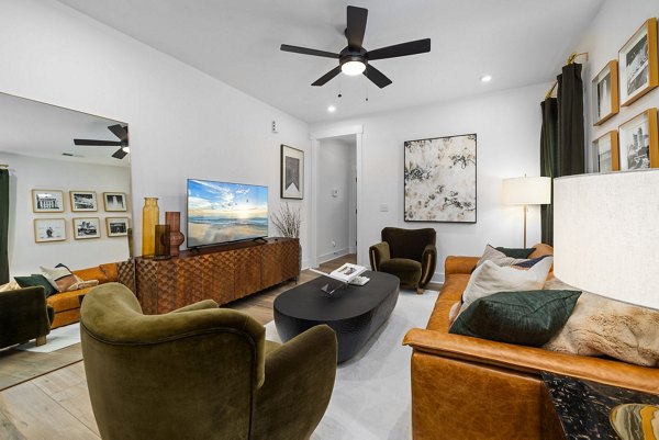 Spacious living room with modern decor at ABODE at Hargett Apartments,  luxury apartments