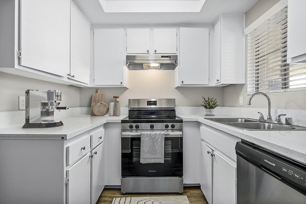 Sleek kitchen with modern appliances at Coronado Palms Apartments, offering luxury living in a vibrant community