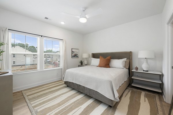 Cozy bedroom with modern decor at Oak Lake Townhomes Apartments