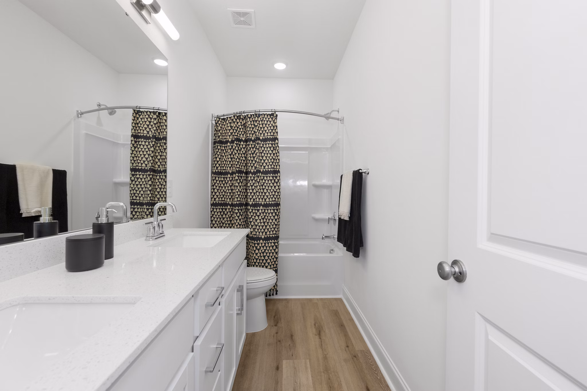 Elegant modern bathroom featuring marble countertops and sleek fixtures at Oak Lake Townhomes Apartments, a Greystar luxury property