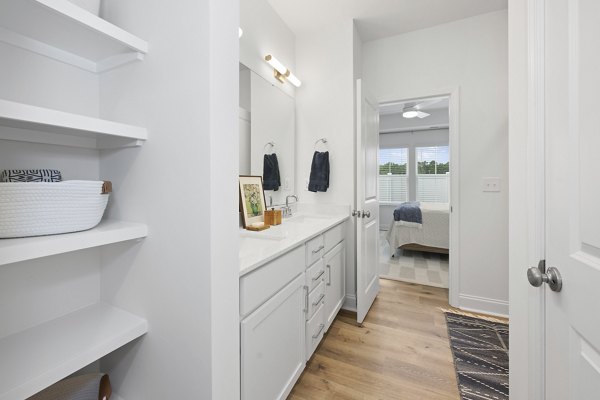 Oak Lake Townhomes: Modern bathroom with sleek fixtures and ample storage