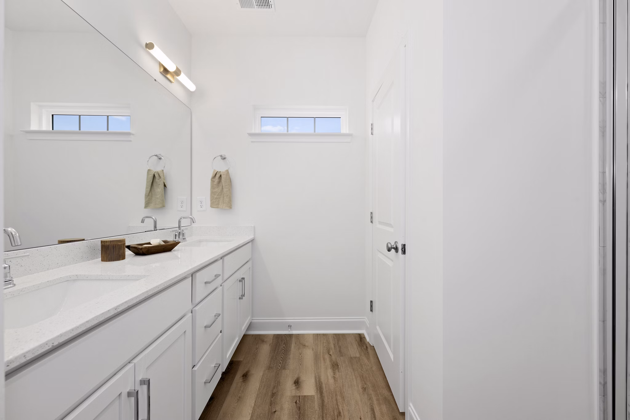 Bathroom featuring elegant vanity and modern fixtures at Oak Lake Townhomes Apartments