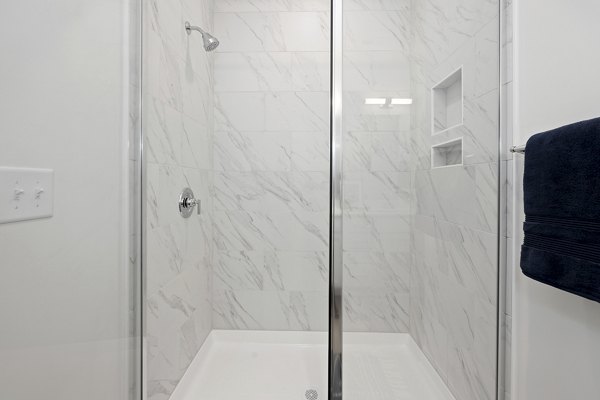 Modern bathroom featuring sleek fixtures at Oak Lake Townhomes Apartments