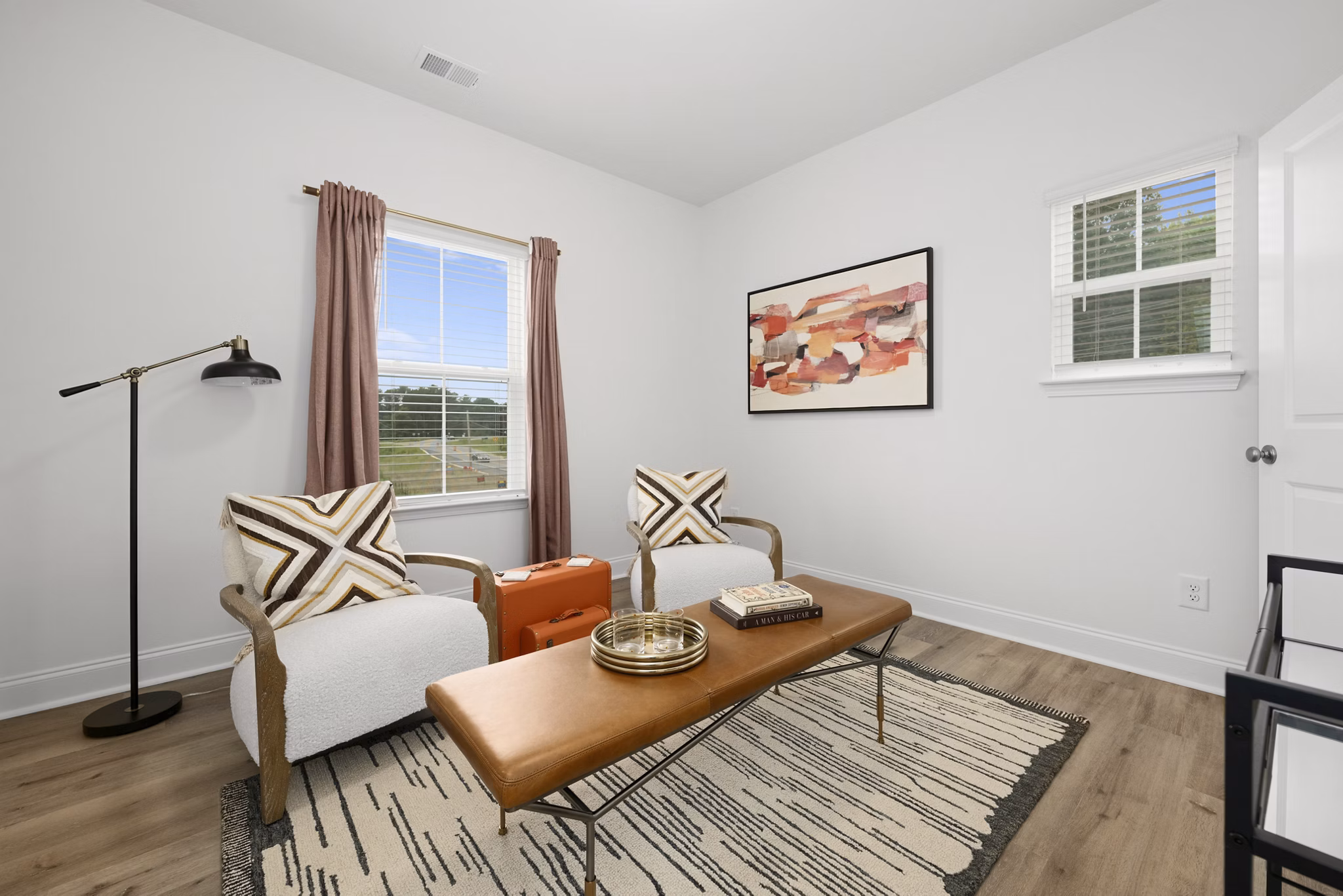 Clubhouse at Oak Lake Townhomes Apartments featuring modern design and cozy seating, ideal for community gatherings