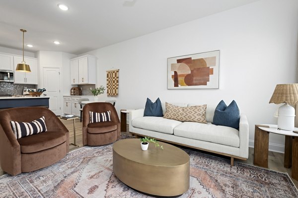 Contemporary clubhouse at Oak Lake Townhomes Apartments featuring elegant seating and modern decor