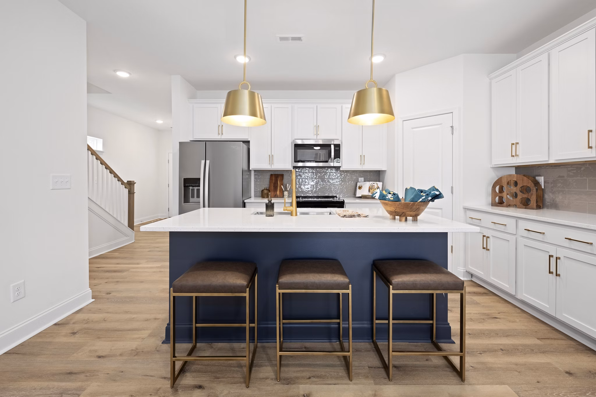 Dining room with elegant lighting and modern decor at Oak Lake Townhomes Apartments