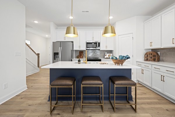 Dining room with elegant lighting and modern decor at Oak Lake Townhomes Apartments