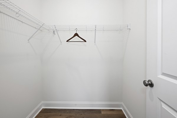 Modern laundry room with energy-efficient machines in Oak Lake Townhomes Apartments