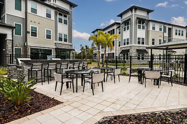 grill area at Encore Narcoossee Apartments 