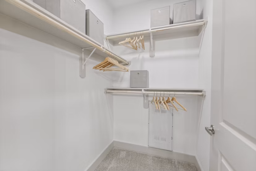 Spacious closet with built-in shelving in Alta Grandway Apartments