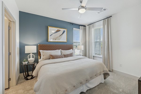 Cozy bedroom with stylish decor at Alta Grandway Apartments luxury living