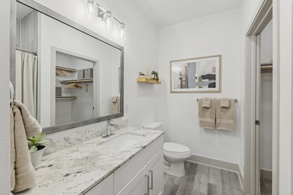 Modern bathroom with sleek fixtures at Alta Grandway Apartments luxury community